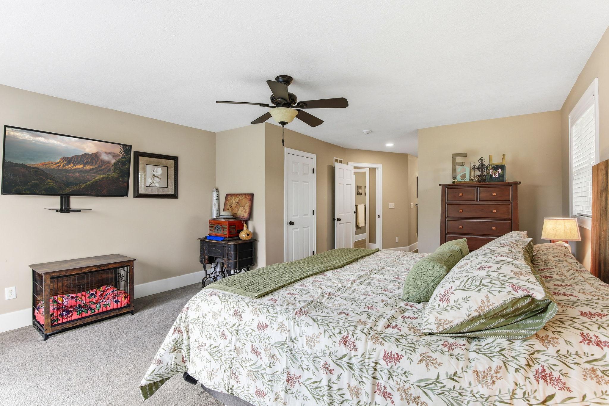 Main Floor Large Owner’s Bedroom with lots of space, walkout to deck and private bath.