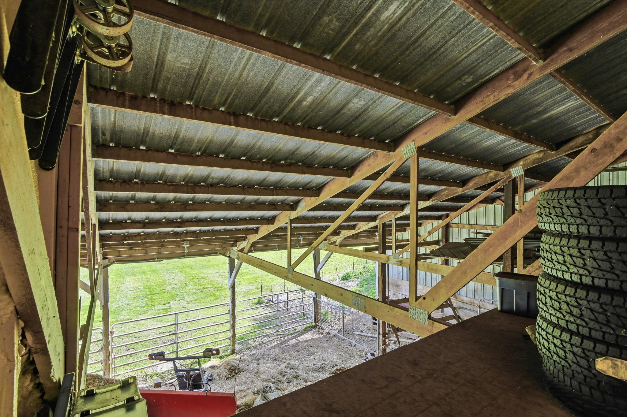 Upper Barn/Loft space with storage for hay, equipment, or seasonal items.