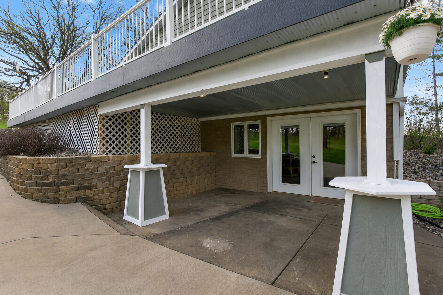 Covered patio with walkout access - great for outdoor seating and shaded space.