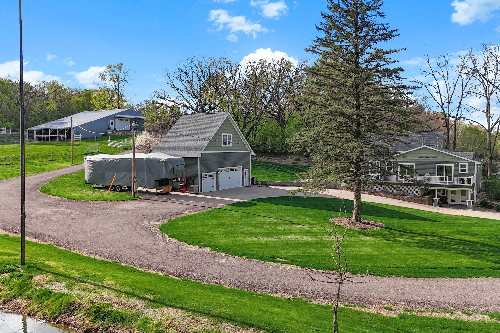 Overhead View highlighting the Home, Detached Garage, and Large Outbuilding with easy access off the driveway.