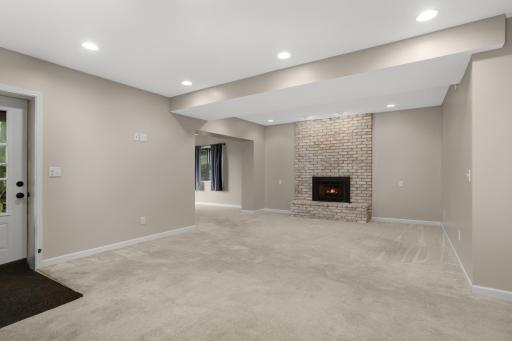 Expansive lower level ready for movie nights and game days.