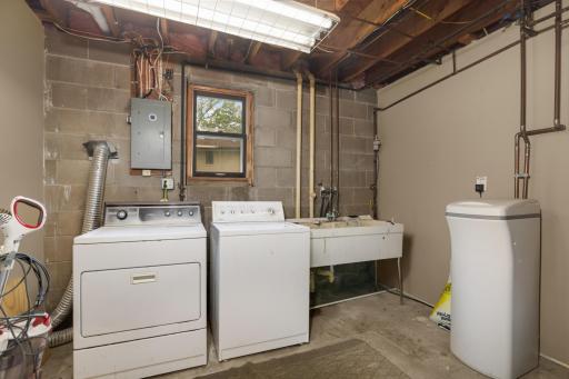 Convenient lower level laundry room and utility sink.
