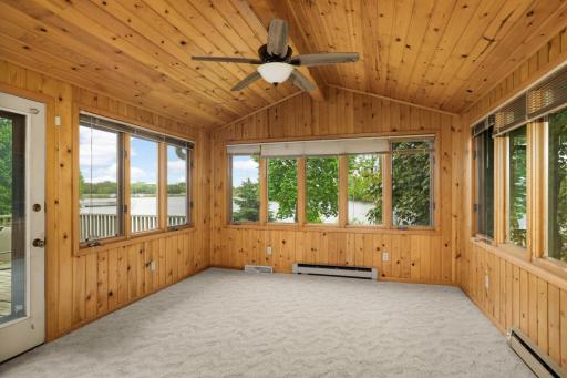 Relax and unwind in the bright four-season sunroom.