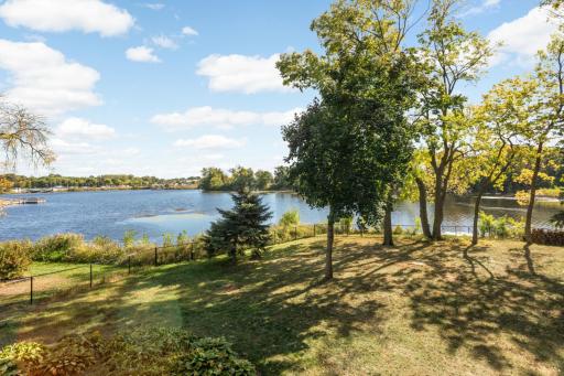 The view from your deck overlooking the fenced in backyard.