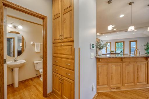 Custom cabinetry, including the hall linen storage by the main floor 1/2 bath