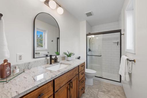 Master suite with quartz c-tops, ceramic shower.