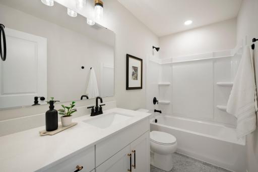 2nd Floor Hall bathroom. This home is just finishing up! Ready for Quick move in. Photos from similar plan. Photos may not depict actual home plan configuration. Features/materials/finishes shown contain options that are not included in price.