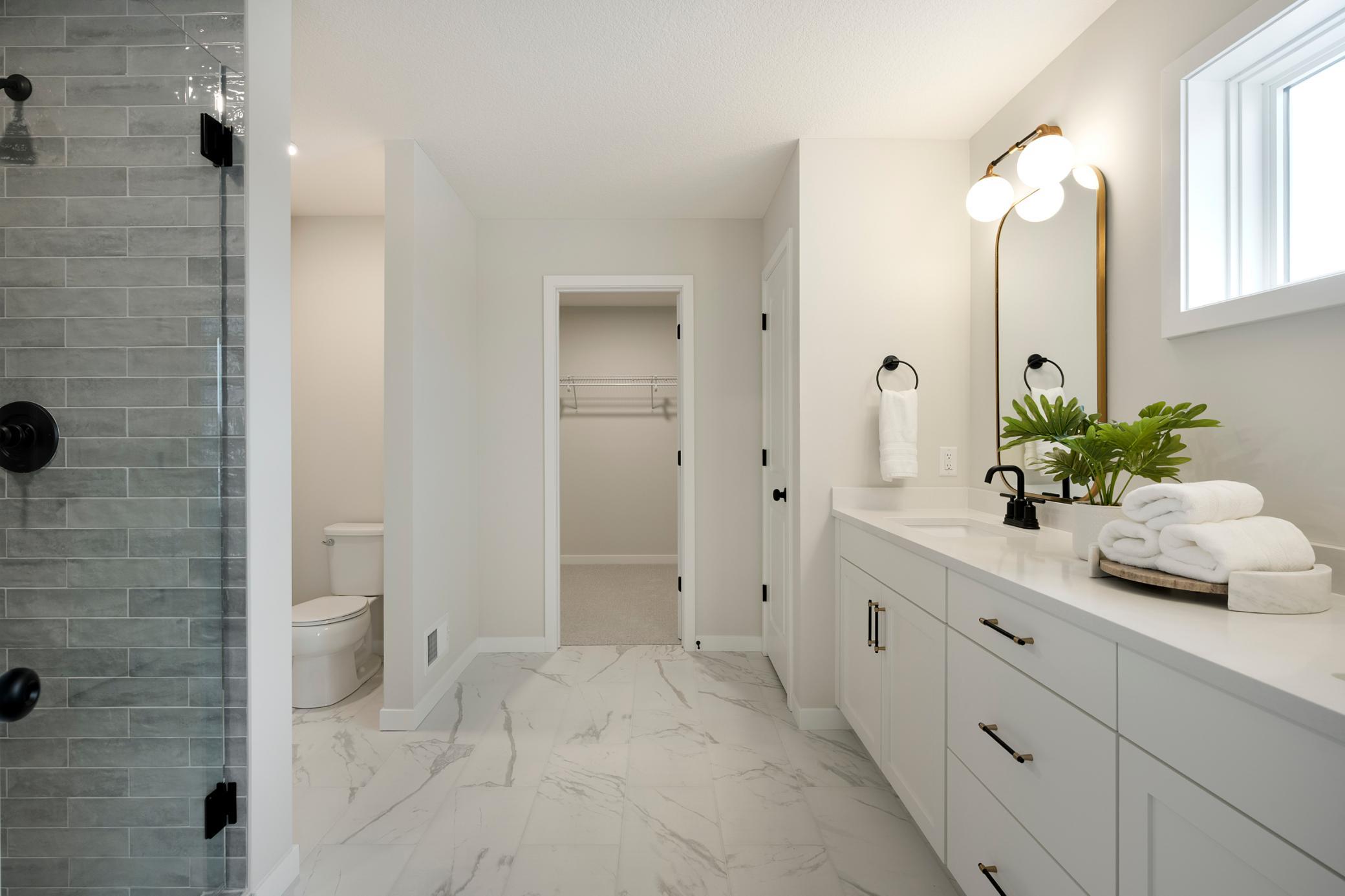 This home is under construction! and includes Separate tub and separate large shower. Photo from similar plan. Photos may not depict actual home plan configuration. Features/materials/finishes shown contain options that are not included in price.
