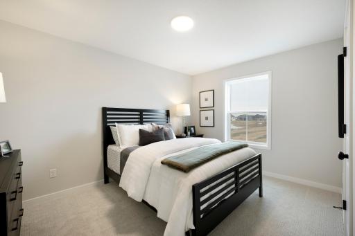 One of 4 bedrooms on 2nd Floor! This home is under construction. Photos from similar plan. Photos may not depict actual home plan configuration. Features/materials/finishes shown contain options that are not included in price.