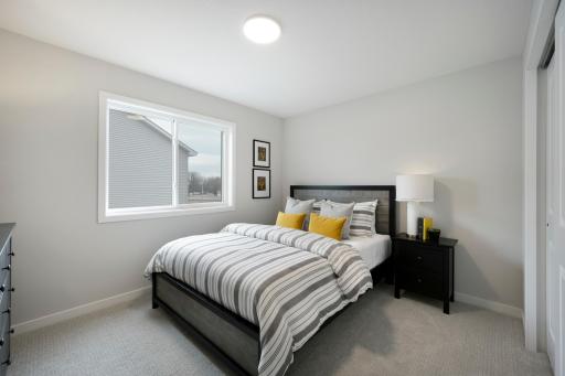 3rd of 4 bedrooms on 2nd floor. This home is just finishing up! Ready for Quick move in. Photos from similar plan. Photos may not depict actual home plan configuration. Features/materials/finishes shown contain options that are not included in price.