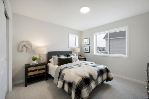 2nd of 4 bedrooms on 2nd floor. This home is under construction. Photos from similar plan. Photos may not depict actual home plan configuration. Features/materials/finishes shown contain options that are not included in price.