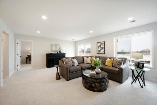 Finished lower level include large family room, game area, 5th bedroom and another bathroom and large lookout windows! This home is almost complete. Photos from similar plan. Photos may not depict actual home plan configuration/features/materials
