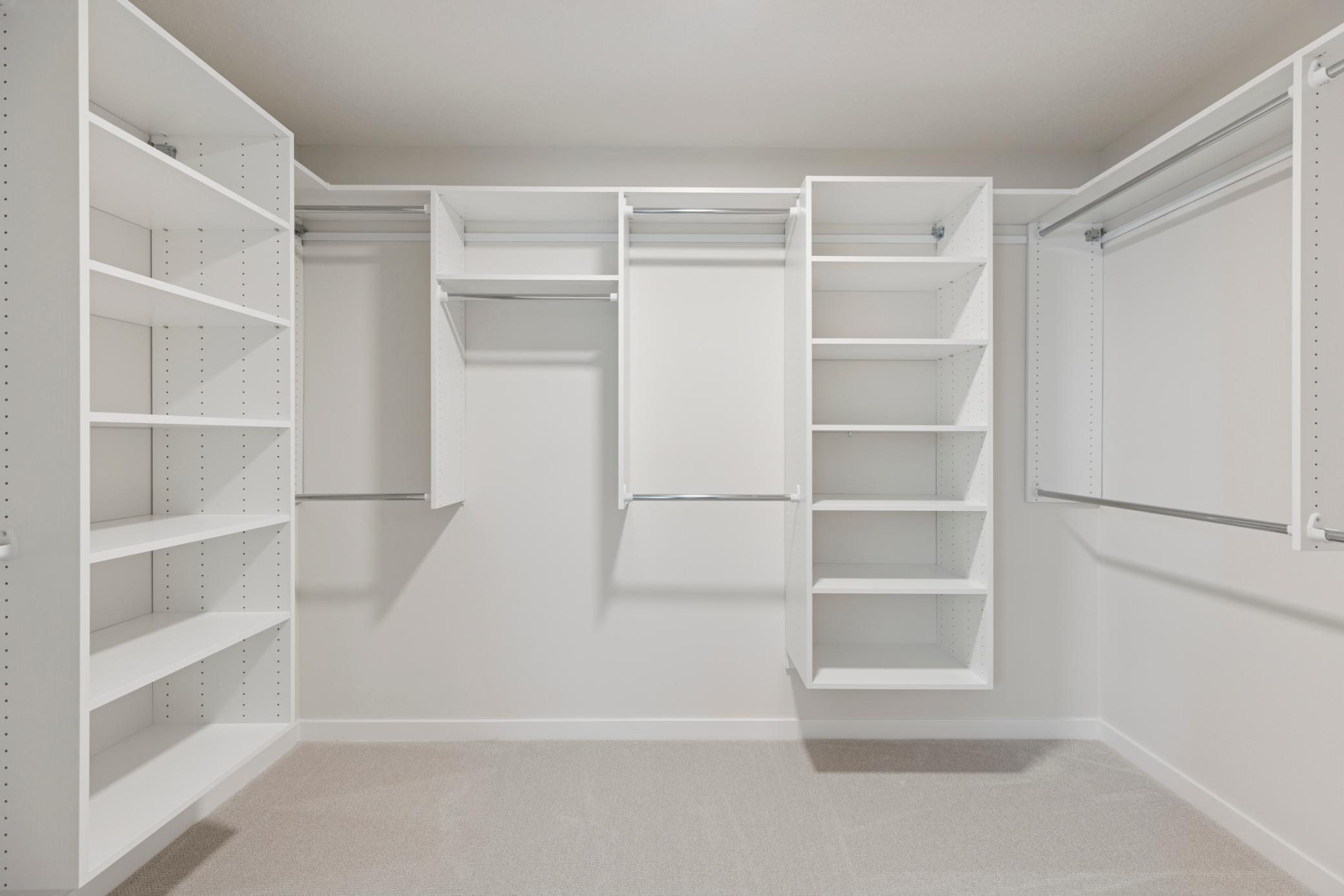 Primary Owner's Closet with shelving included for an amazingly organized Closet! Photos taken from model of similar floor plan. This home is under construction! Ready in July!