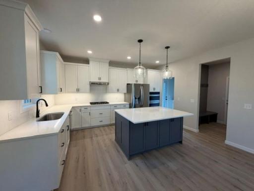 Abundance of custom kitchen cabinets, soft-close drawers and doors, large center island, morning kitchen with easy access to large deck, perfect for outdoor dining; and for grilling year-round.