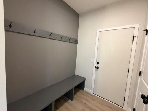 Enjoy the convenience of a spacious mudroom custom built-in bench, plus closet for our Minnesota 4 seasons! Easy access to kitchen and hauling in the groceries!