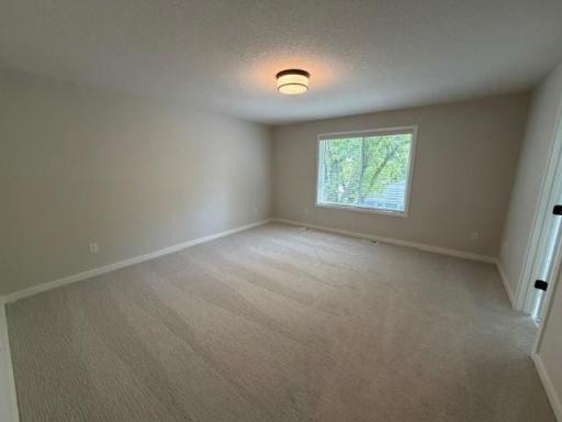 Spacious Primary Suite with private luxurious bathroom and huge closet w/upgraded closet organizer.