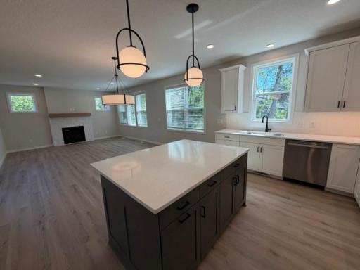 Abundance of custom kitchen cabinets, soft-close drawers and doors, large center island, and beautiful morning pantry with access to large deck perfect for outdoor dining; and for grilling year-round.