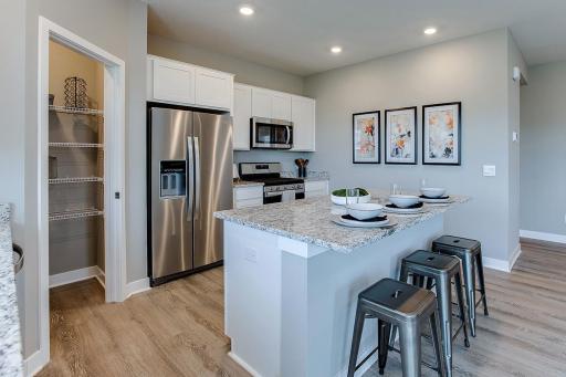 One last look at the kitchen space. Just an awesome use of space!!! (Photo of model, colors are similar)