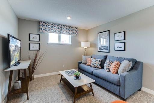 A top the staircase you will find the home's loft area, which offers more than 100 square feet of additional living space and located just steps away from each of the home's four upper level bedrooms! (Photo of model, colors are similar)
