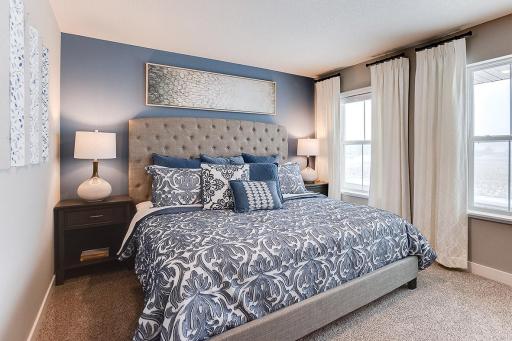 The homes primary bedroom is an oasis of its own! Complete with a private bath and not one but TWO walk-in closets, it's the perfect setting to start and end each day in! (Photo of model, colors are similar)