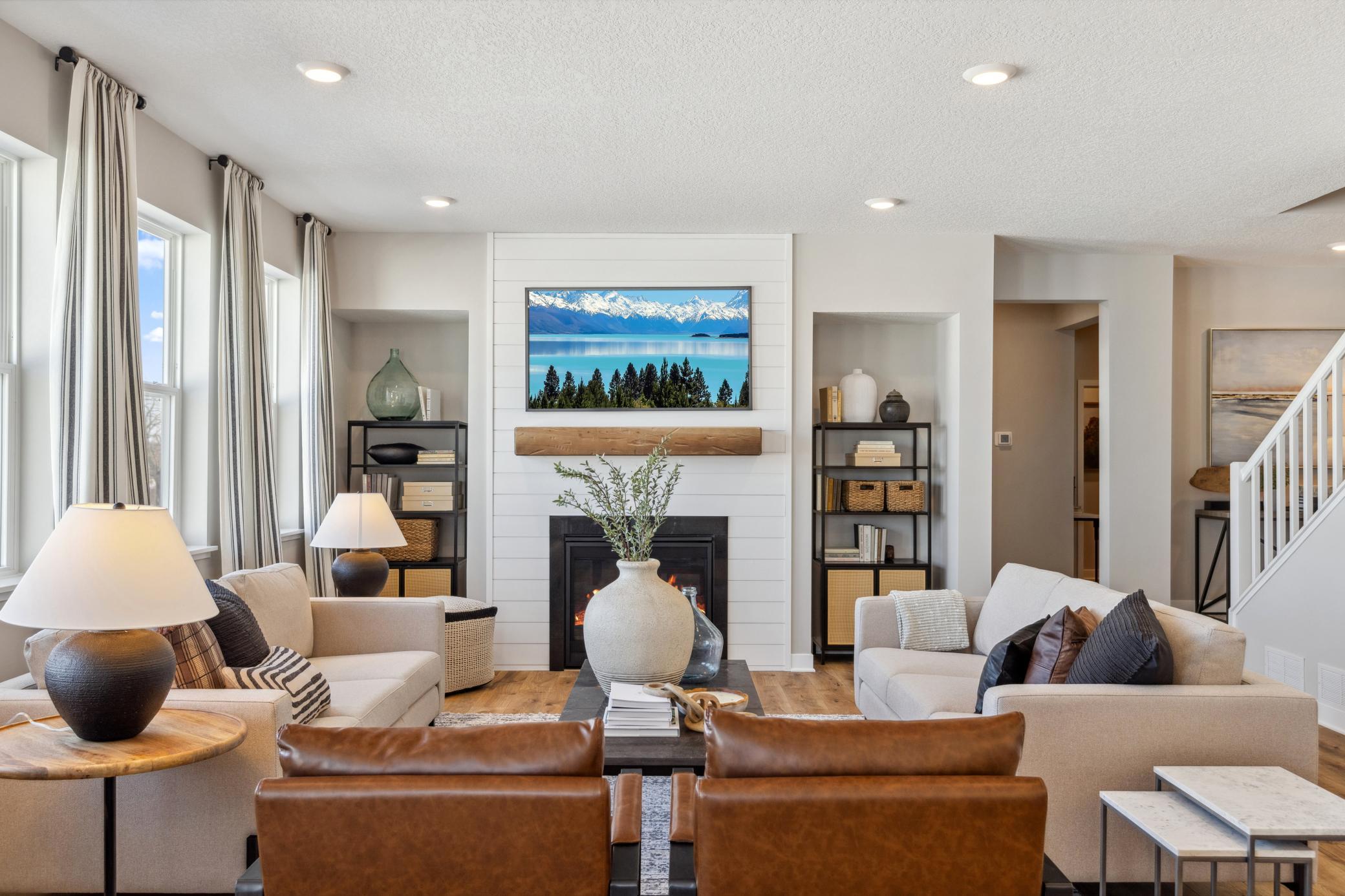 Shiplap fireplace anchors this space.