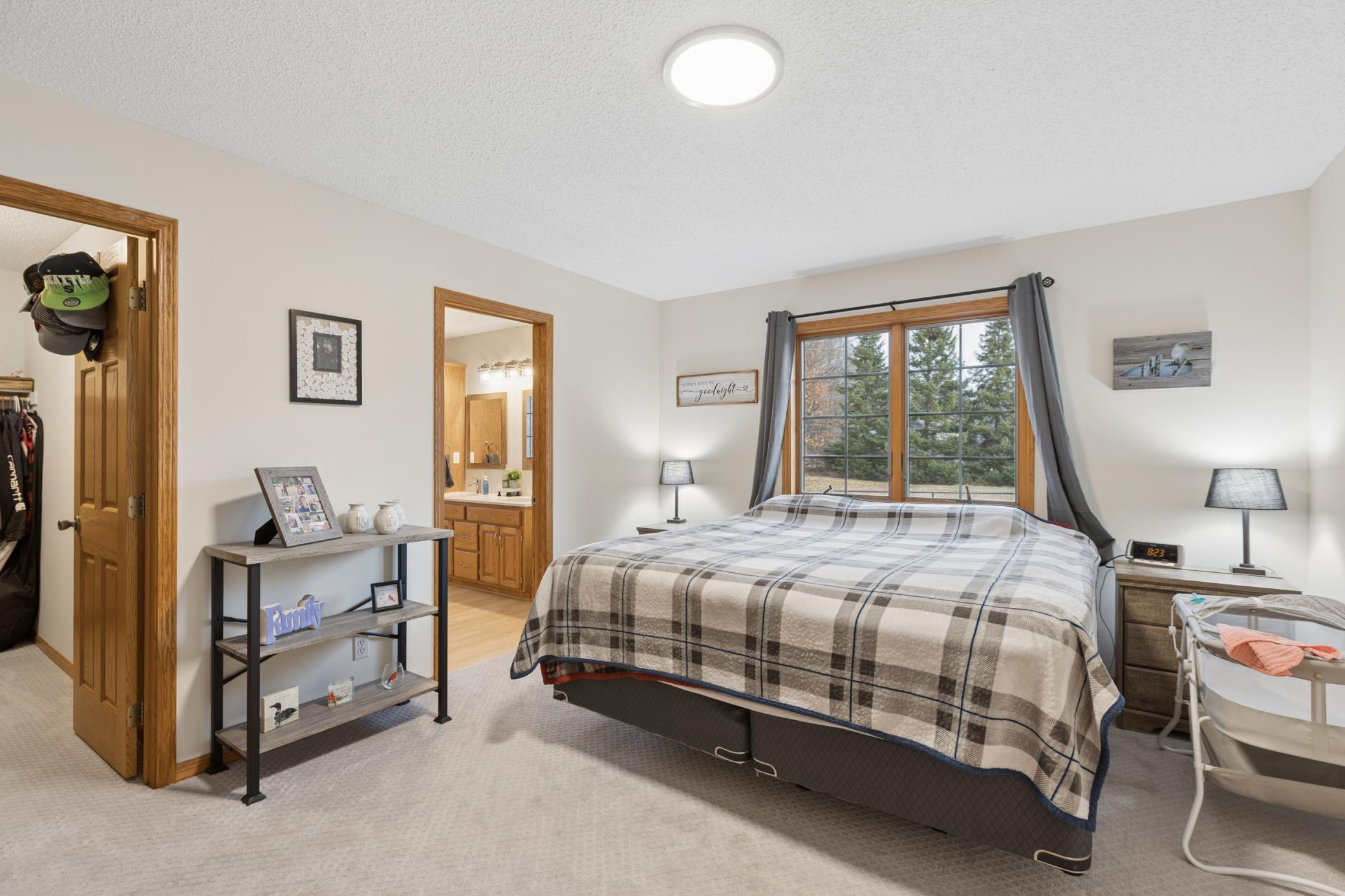 Spacious primary bedroom with private full bath and walk-in closet