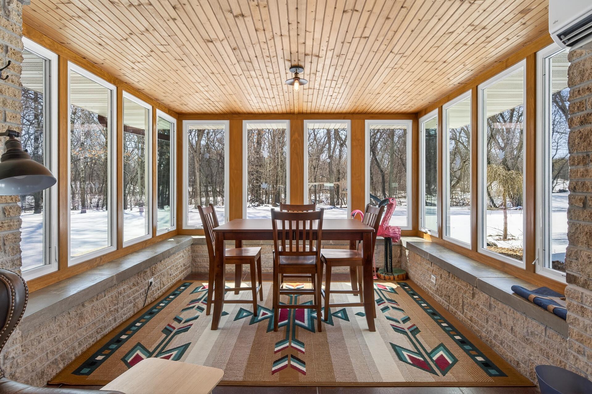 Great recently finished 4 season porch with new window and a split package heat and cooling source.