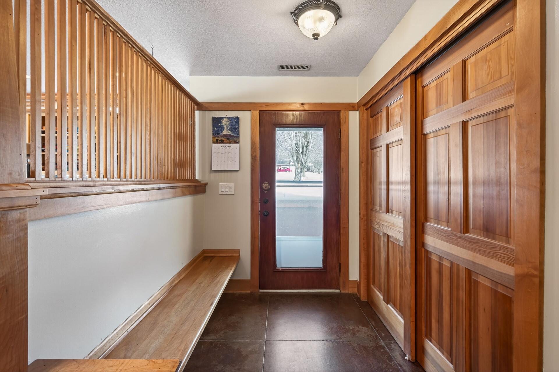 A nice setting area as you enter to remove shoes and hang your coats.