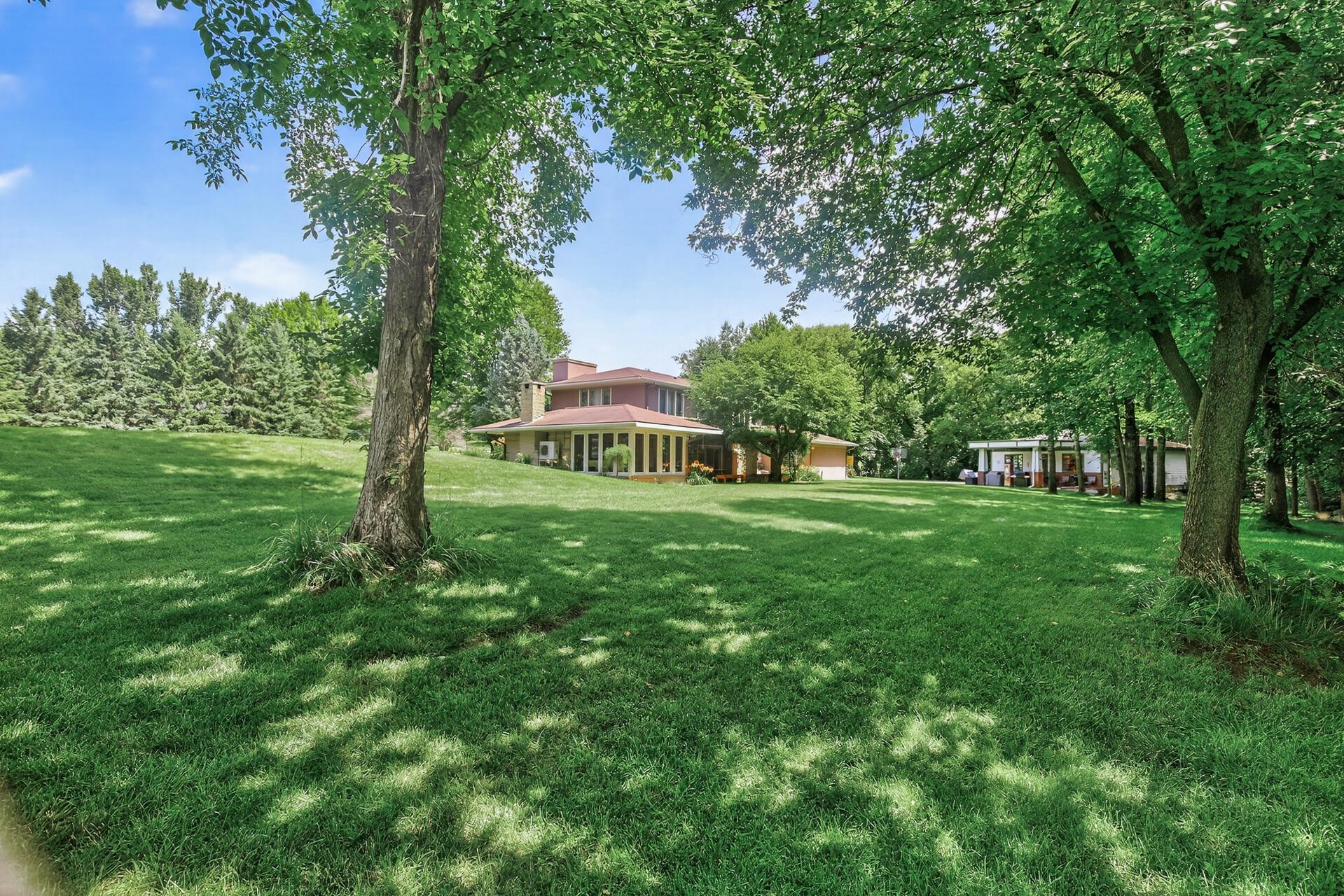 2.5 Acres of manicured lawn, trees and flowers.