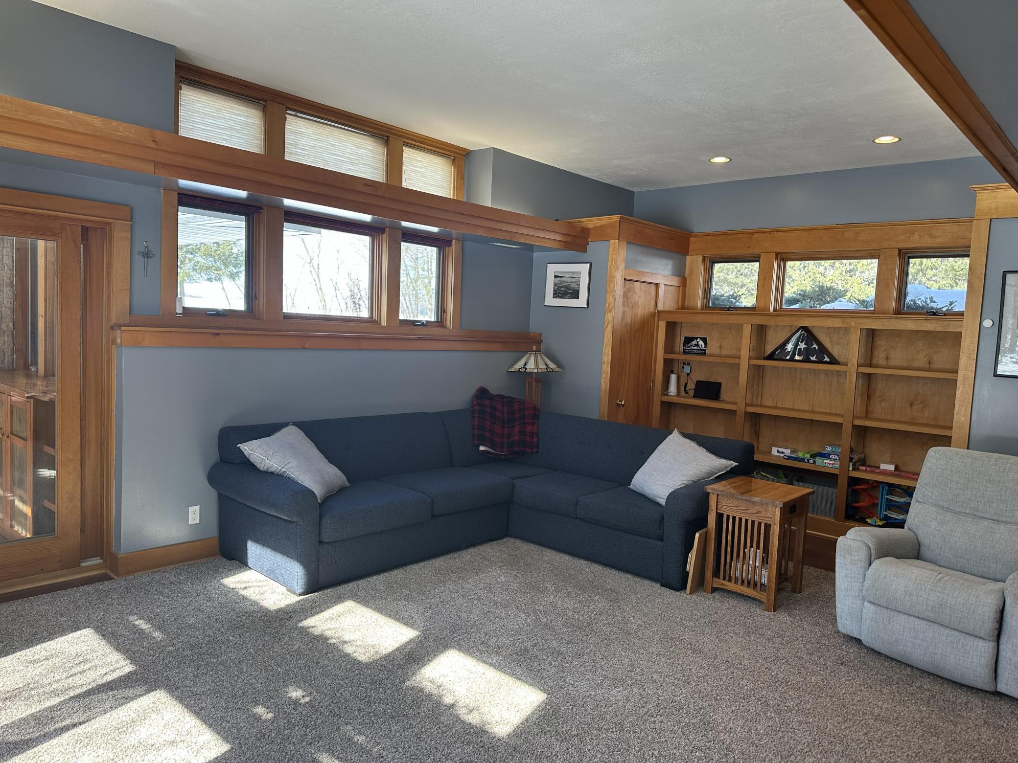 Main floor living room with built in storage.