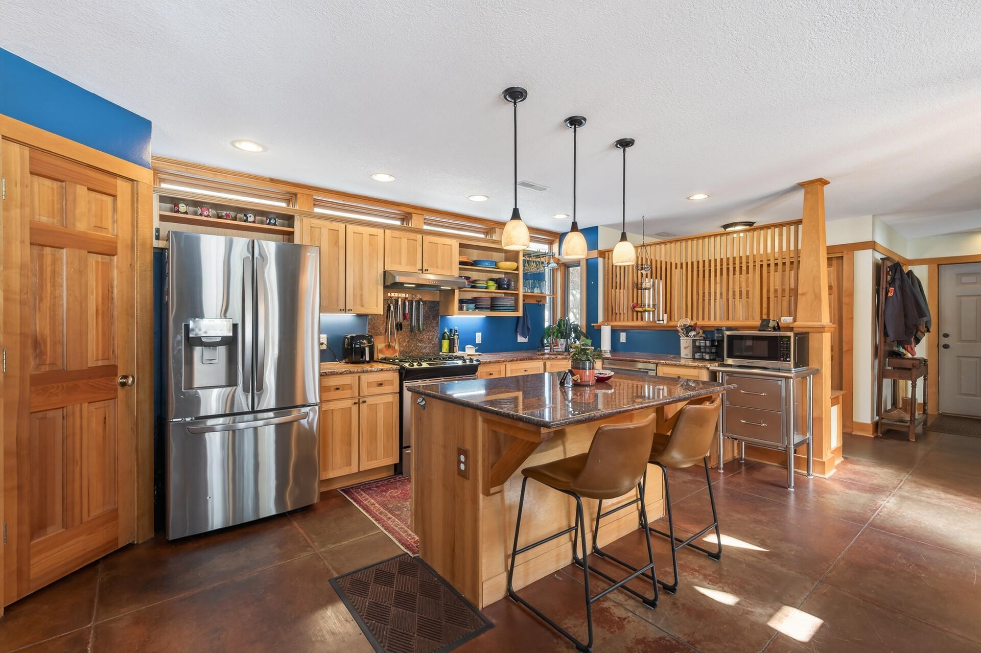 Wide open kitchen with great natural lighting and stainless appliances.