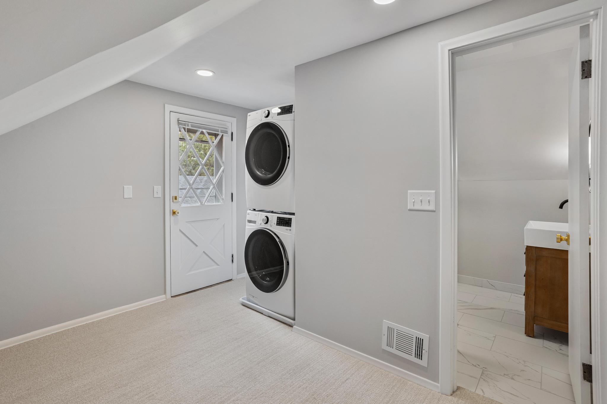 Owners Suite with a washer & dryer