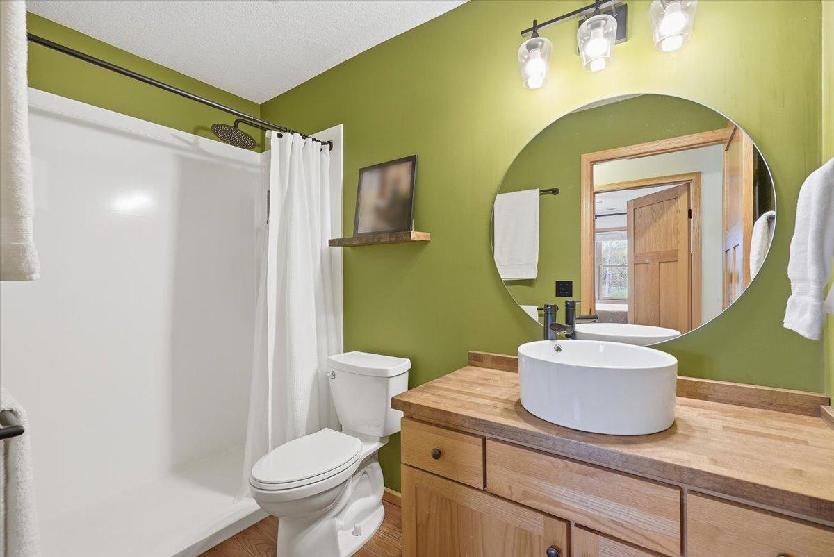 Upper level 3/4 bath with walk-in shower.