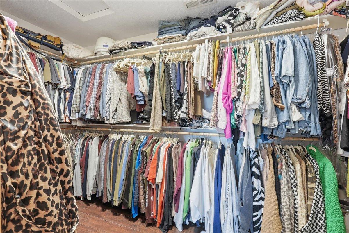 Spacious primary walk-in closet.