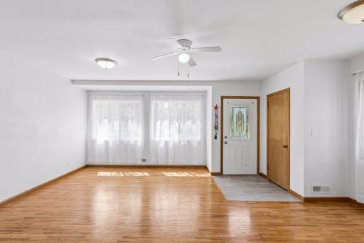 Bright and airy south facing living with new front windows in 2020. New tile entry and refinished hardwood floors in 2020.