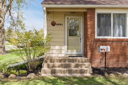 Low maintenance exterior with vinyl siding and brick facade.