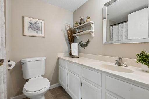 Primary 3/4 bath features an oversized vanity