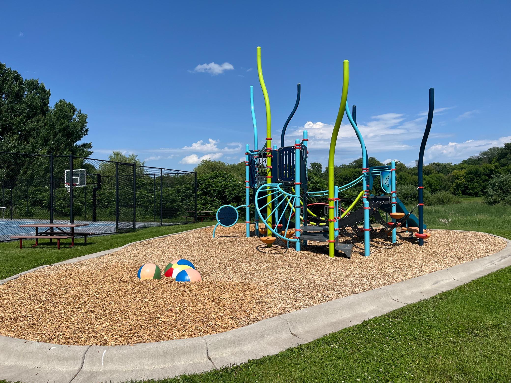 Woods Creek Park has something for everyone including basketball, tennis, playground and scenic paved trails to explore.