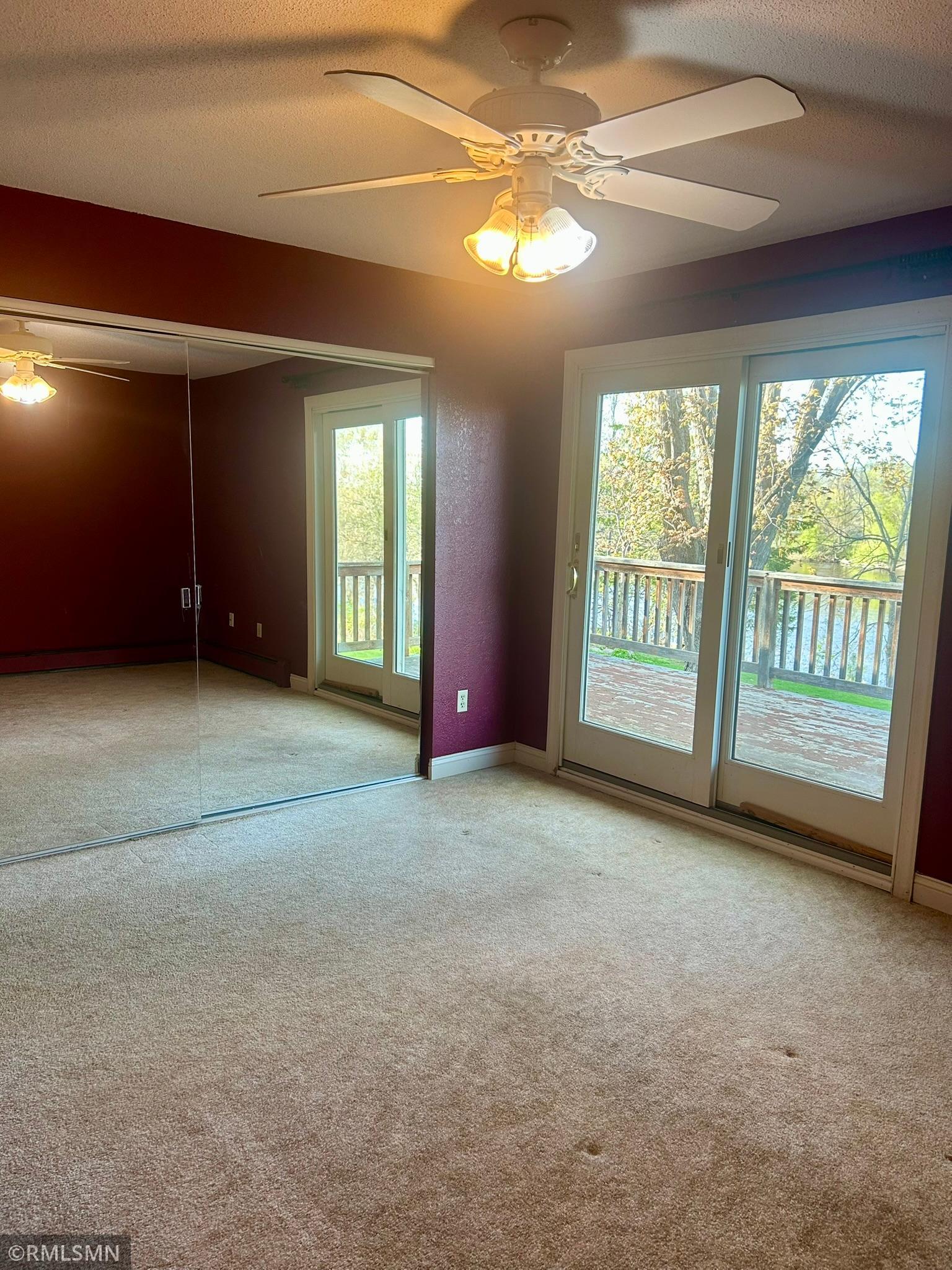 Main bedroom with sliding door to deck