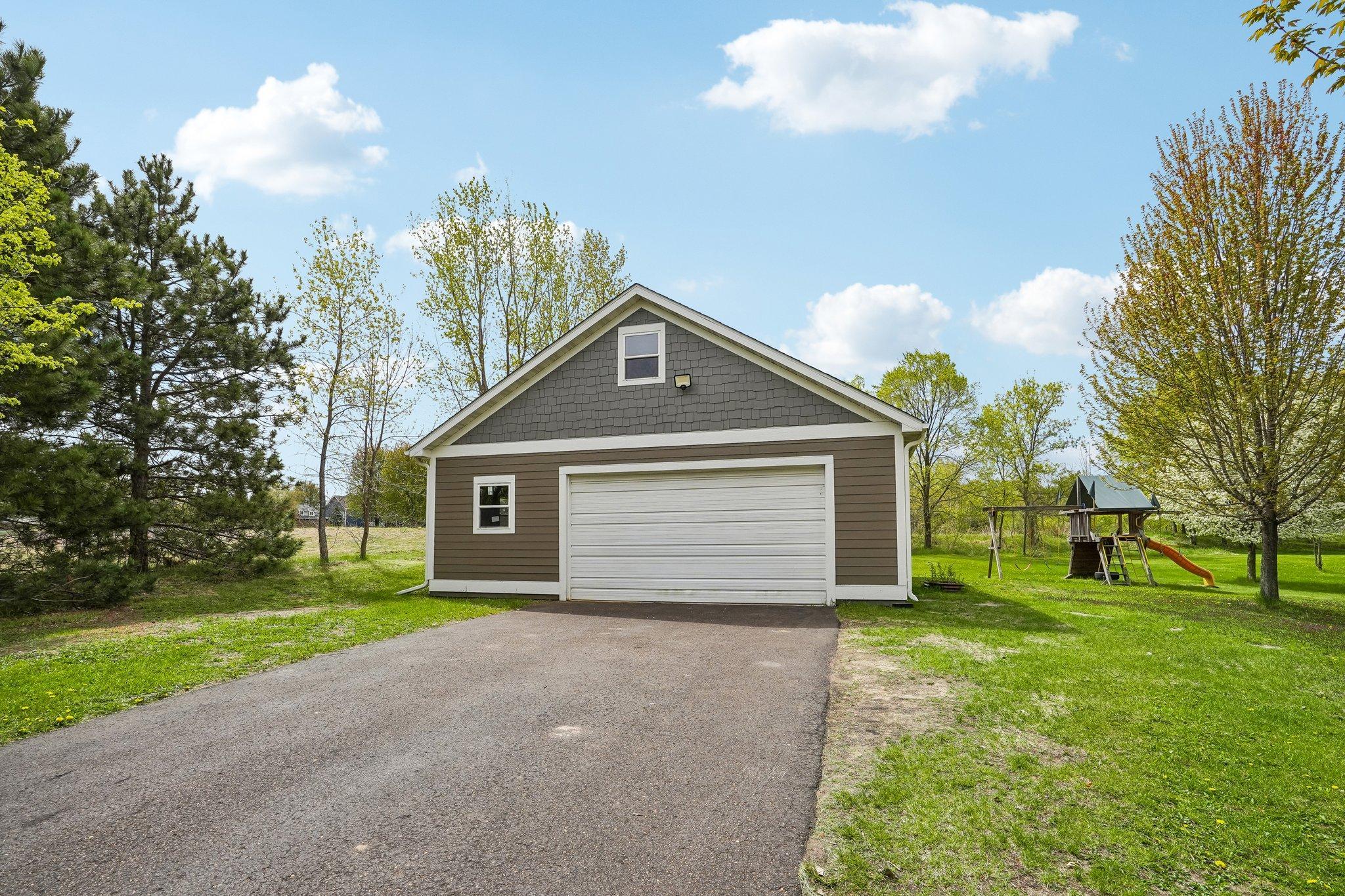 Additional detached heated garage or shop space.