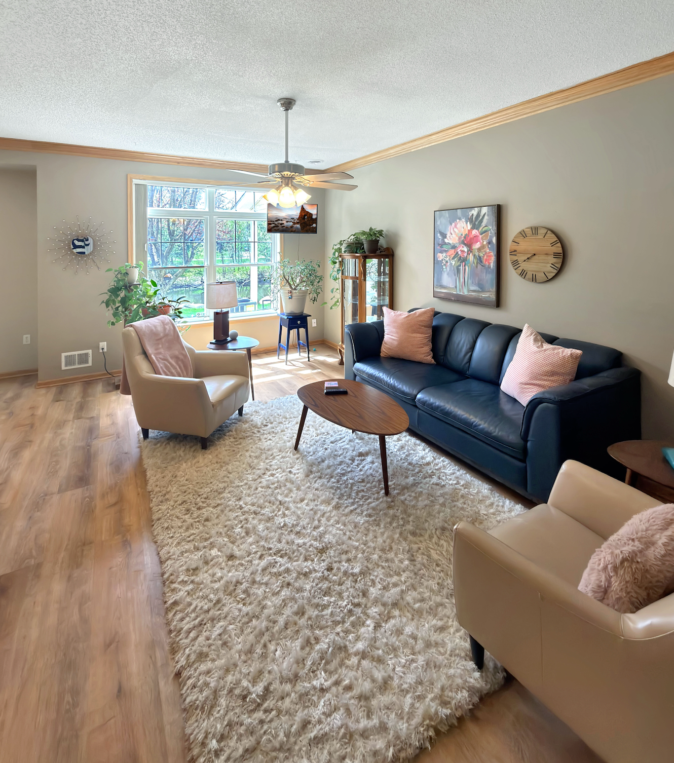 Main floor living space with crown molding and new LVP.