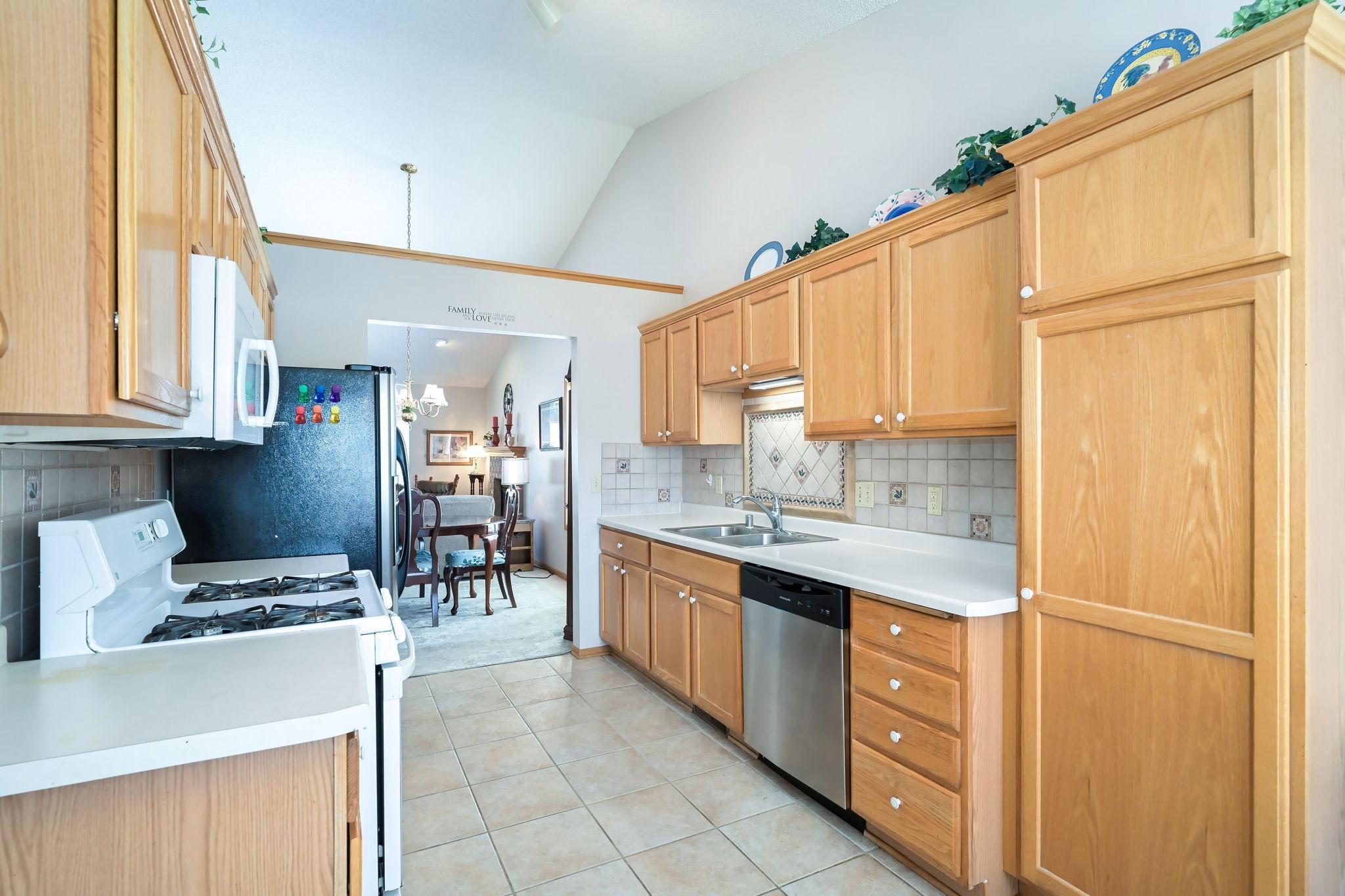 Vaulted ceiling through kitchen, dining room, and family room