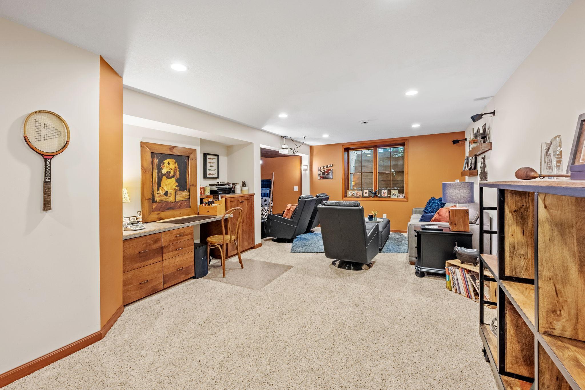 Finished basement with theater and large storage area
