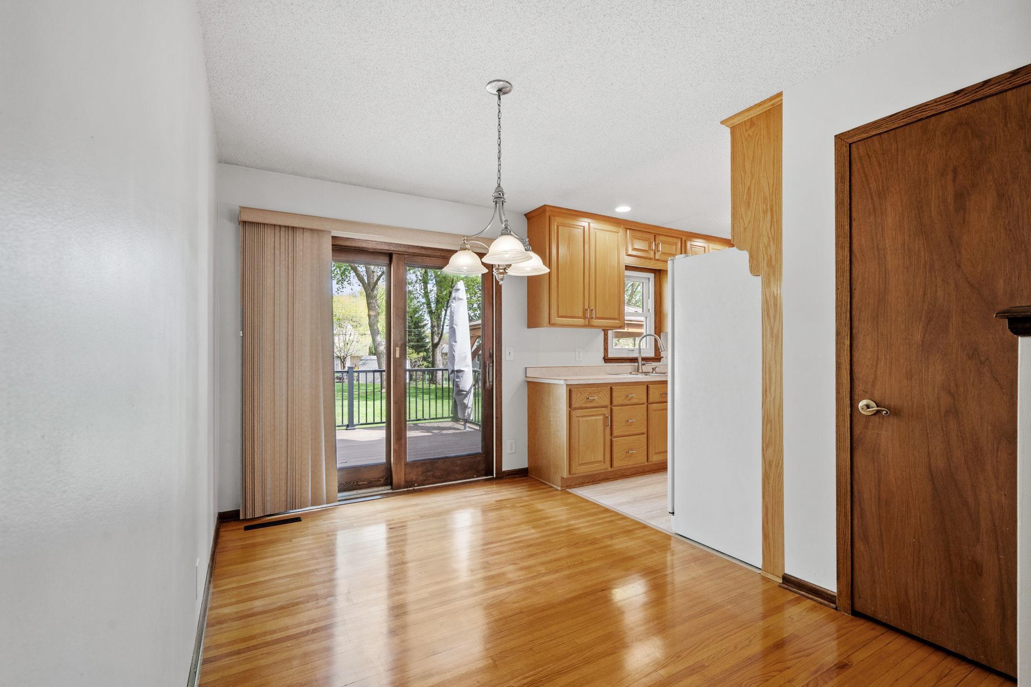 Dining room walks out to a maintenance-free deck and gorgeous stamped concrete patio!