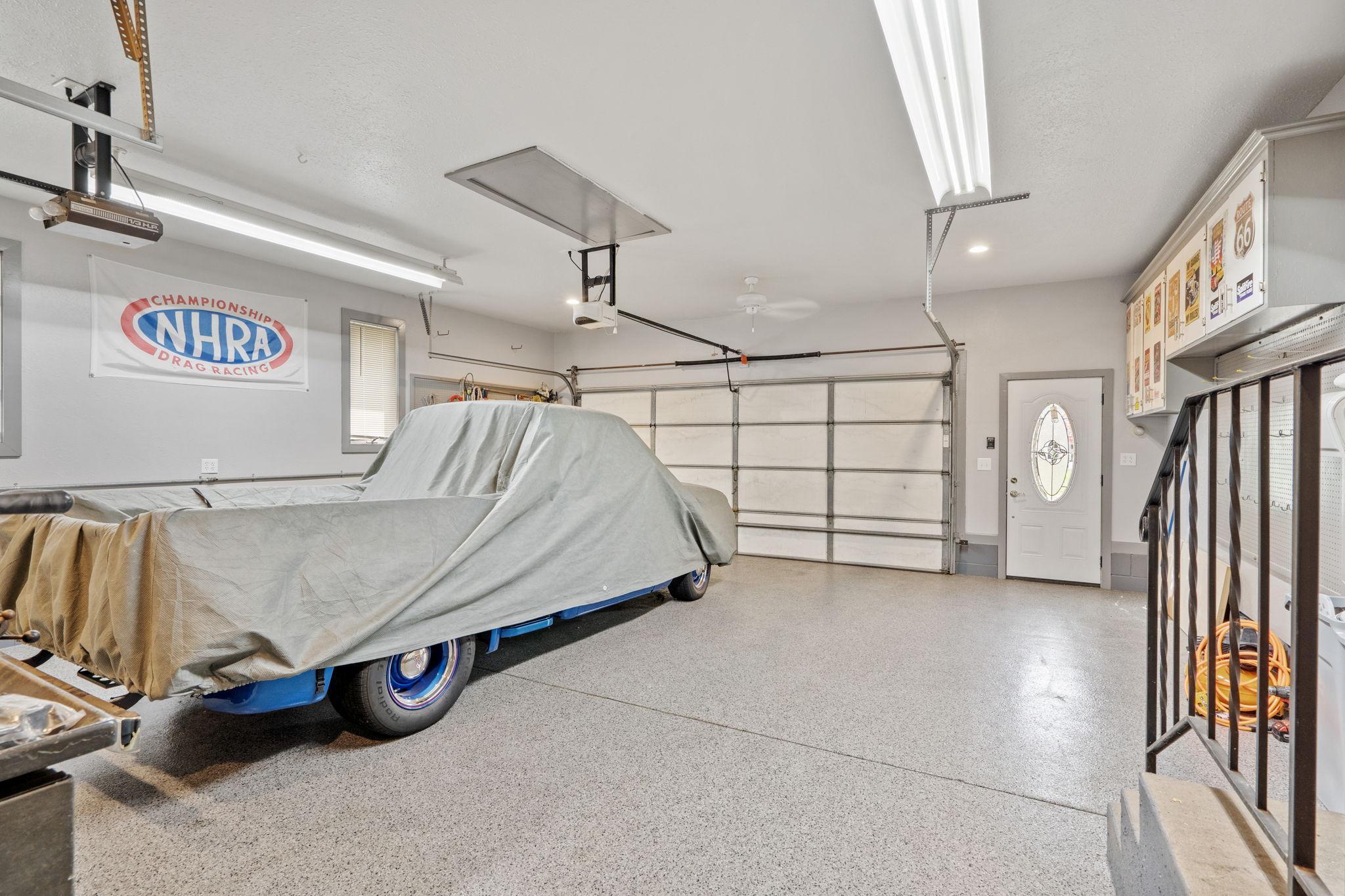 HUGE garage space with a rear garage door to the back yard