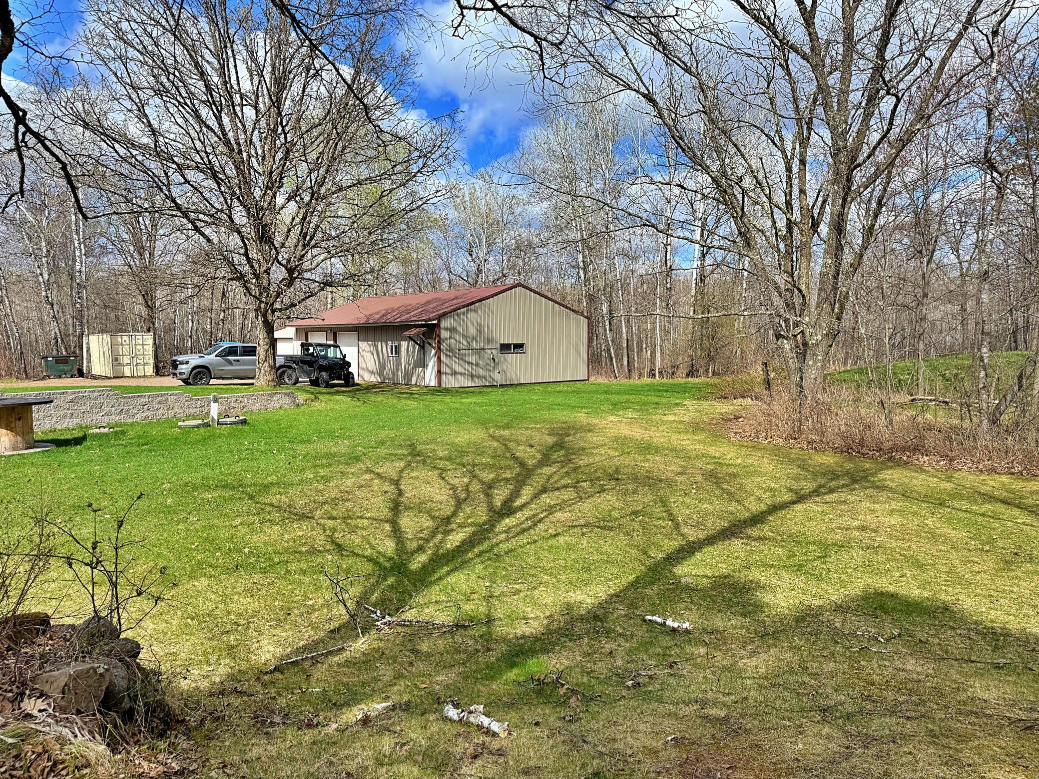 Grassy yard space with view of garage.jpeg