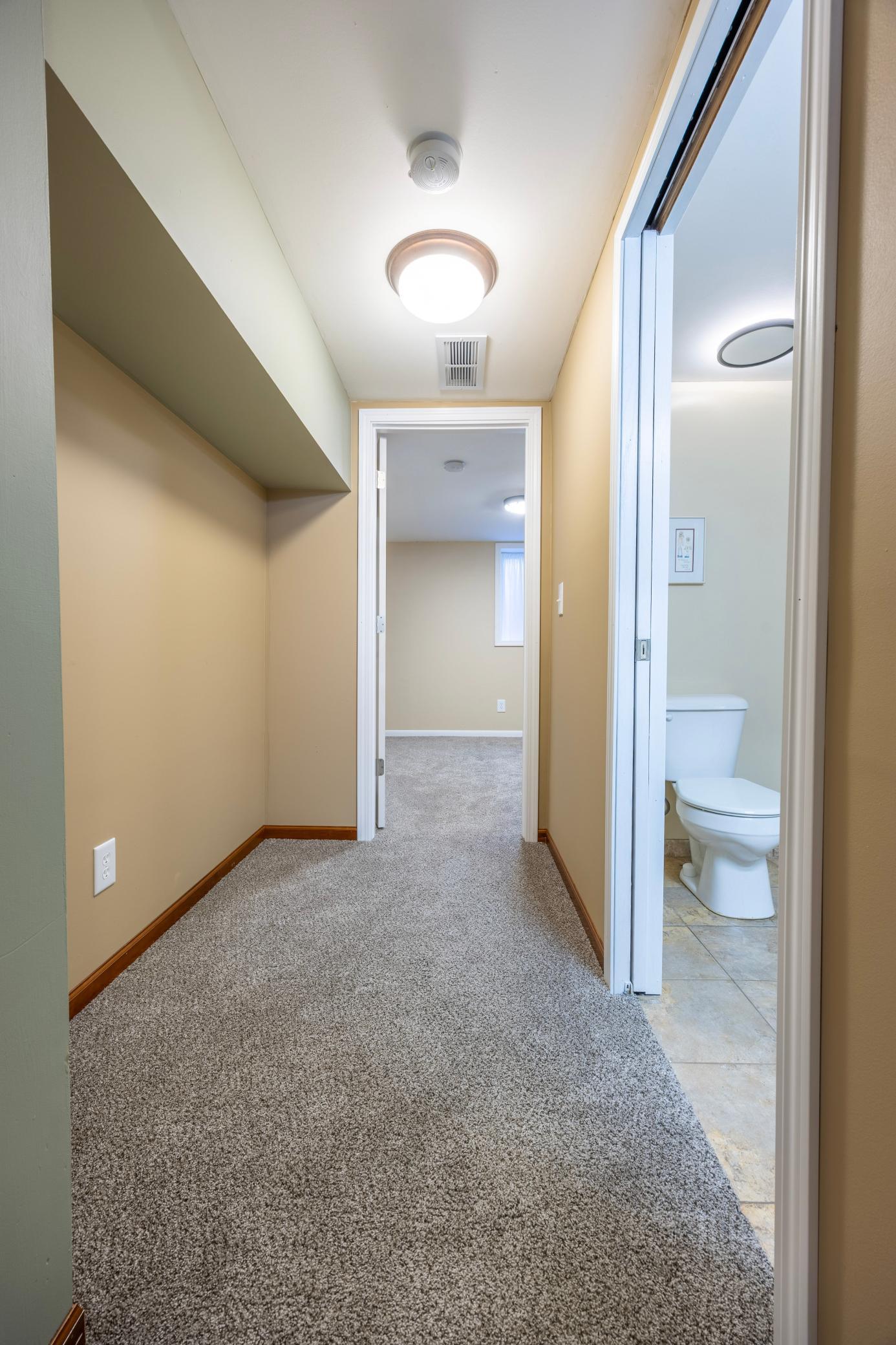 Lower level is complete with a fourth bedroom and 3/4 bathroom