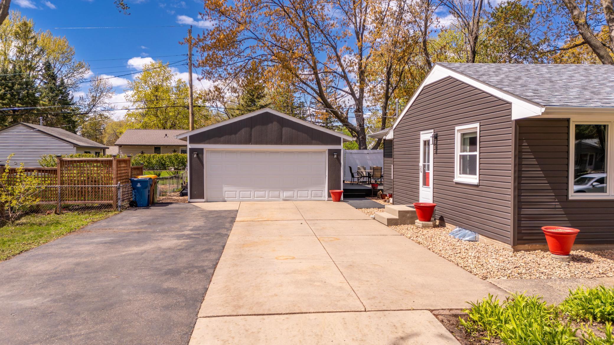 Large driveway with detached garage