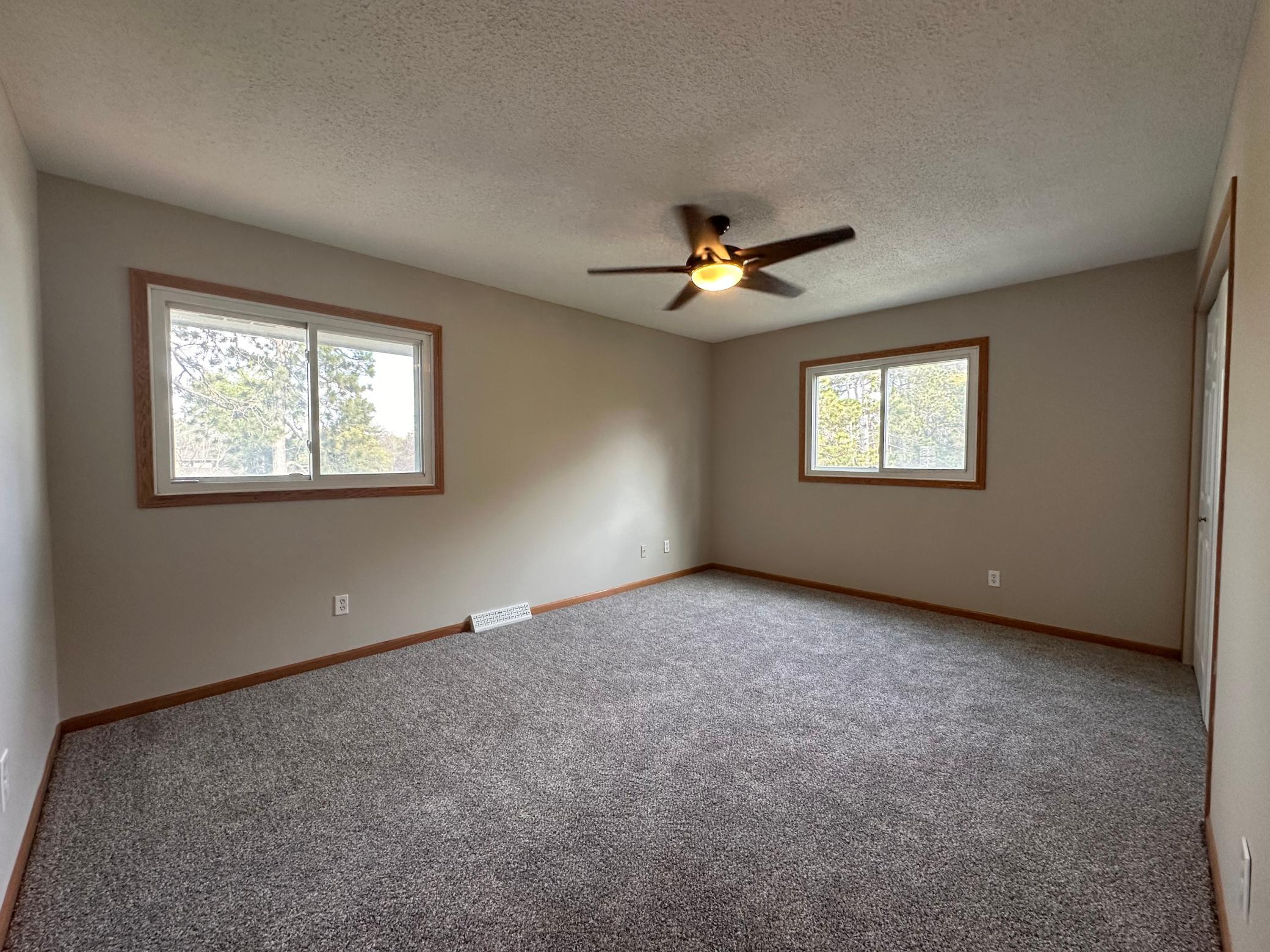 Second bedroom leads to walk-thru bathroom and out to upper level landing