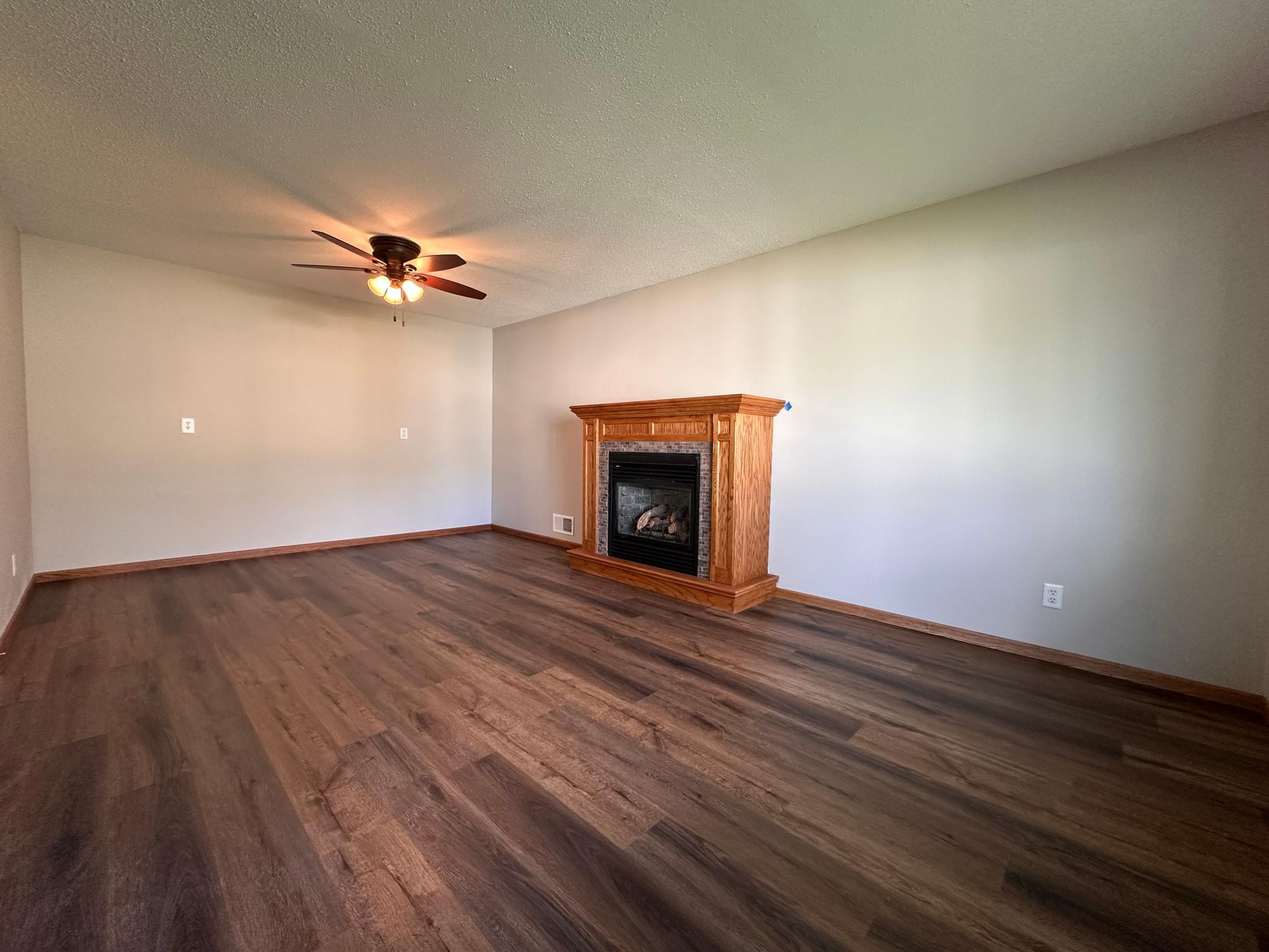 Main level great room with gas burning fireplace.